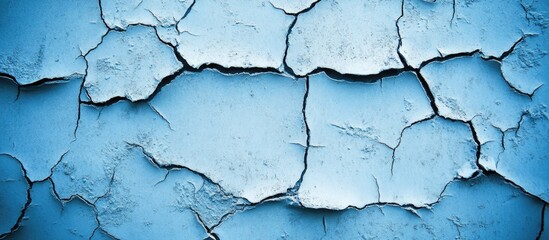 Obraz premium Cracked blue paint texture with visible peeling layers and Copy Space for design purposes