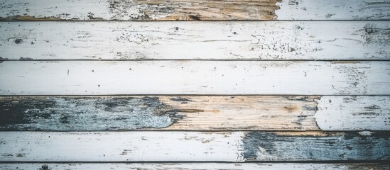 Obraz premium Weathered wooden planks background with peeling white paint and natural wood texture ideal for creative design projects Copy Space