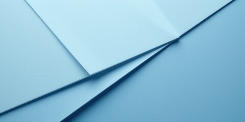 Obraz premium A delicate, light blue sheet elegantly folded diagonally; its smooth, softly curved edges contrast against a serene sky-like backdrop