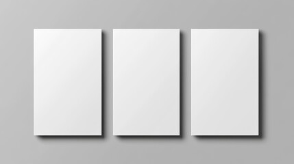 Three blank rectangular posters arranged in a row on a gray background with shadows and copy space for text or graphics
