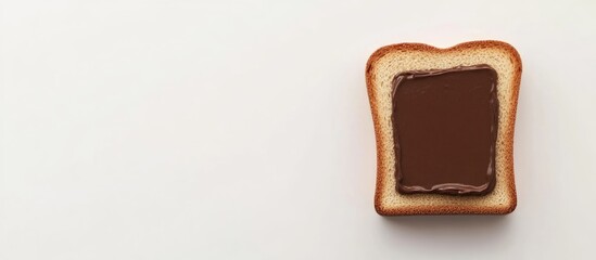 Slice of bread with chocolate spread on a clean white surface with ample copy space