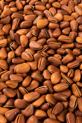 close up of roasted pine nuts background 
