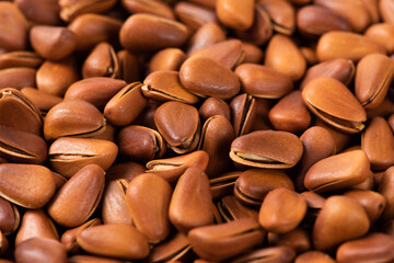 close up of roasted pine nuts background 
