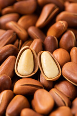 close up of roasted pine nuts background 