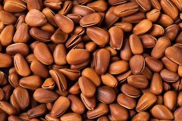 close up of roasted pine nuts background 