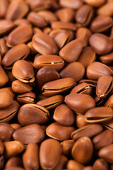close up of roasted pine nuts background 