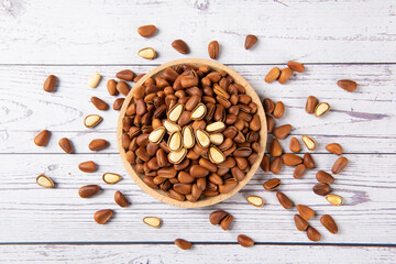 roasted pine nuts food on wooden table.
