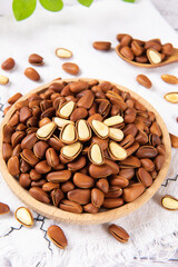 roasted pine nuts food on wooden table.