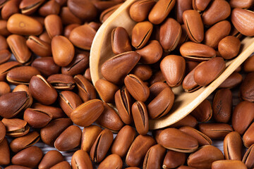 close up of roasted pine nuts background 