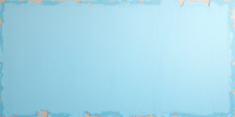 Fototapeta premium A captivating outdoor scene featuring a light blue painted wall with a textured, uneven finish. The upper half gleams with fresh blue paint contrasting beautifully against the rugged lower section