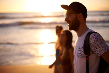 People, sunset and walk on beach for travel, summer holiday and happy for study break. Friends,...