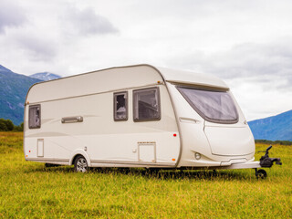 Vacation with Caravan car. Family travel RV, holiday trip in motorhome with beautiful nature landscape	