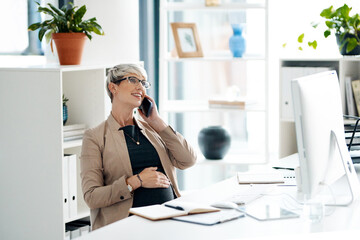 Pregnant woman, phone call and talking with smile at office with telephonic interview for home decor magazine. Person, writer and mother with smartphone, contact and touch stomach at creative agency