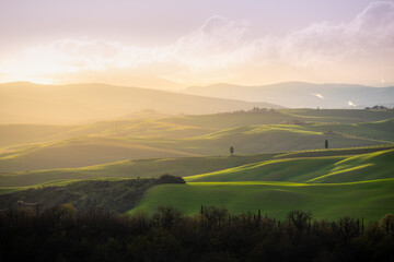 Aerial view of Tuscan hills at sunset, Italy.