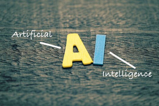 AI (Artificial Intelligence), color wooden small alphabet on wooden background