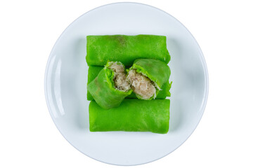 Traditional dadar gulung on white plate isolated background