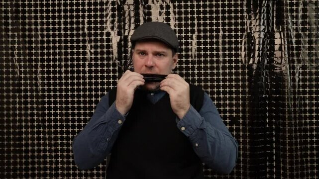 Man playing the harmonica, person expressing lifestyle through musical instrument, blowing harmonica for leisure and fun