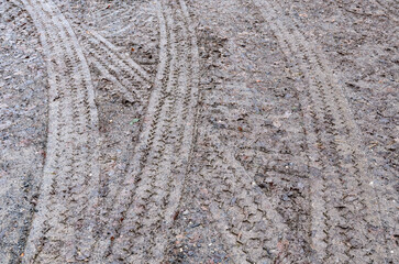 Tire tracks on mud, muddy road and ground