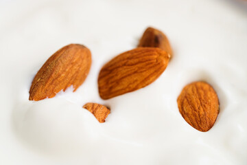 Yogurt with almonds closeup shot