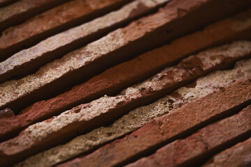 closeup stacked old brick cut tiles