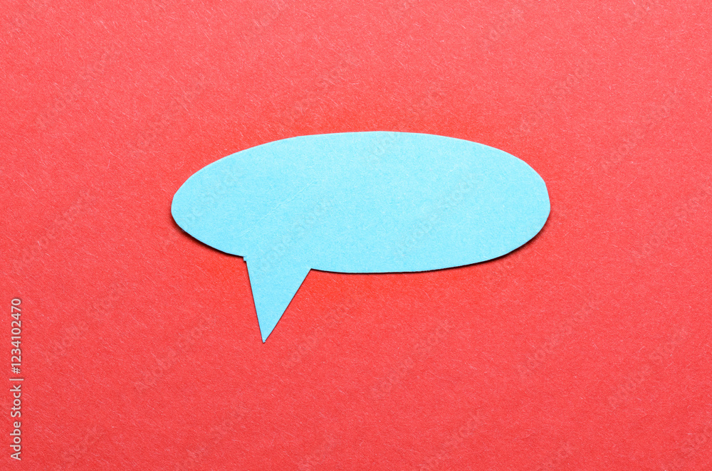 Poster blue cut out blank paper speech bubble of round shape with copy space for text on red background, fl