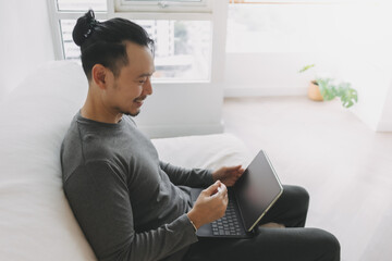 Freelance digital nomad man work online in the room feel happy.