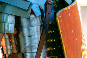 detail of an armour of metal plates and a shield of a Roman legion soldier at a historical...