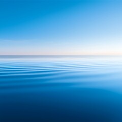 Obraz premium Calm Ocean Surface Under a Clear Blue Sky