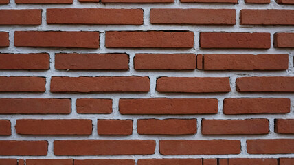 Obraz premium Aged Red Brick Wall Surface Ideal for Classic Urban Design and Exterior Building Material