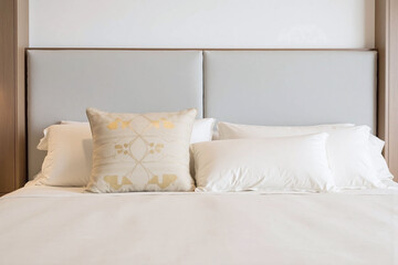 modern minimalist bedroom with gray headboard geometric