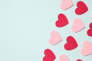 Various hearts on color background