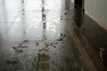 Shoe prints on the wet floor