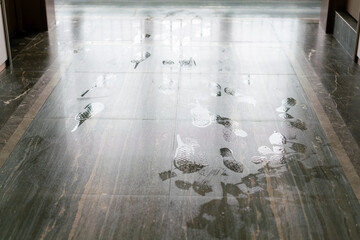 Shoe prints on the wet floor