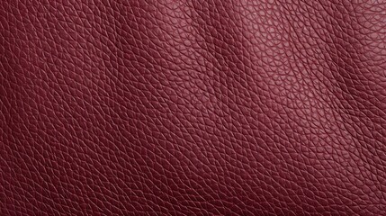 Fototapeta premium Close-Up View of Maroon Pebbled Leather with Textured Pattern Suitable for Various Design Applications and Fashion Uses