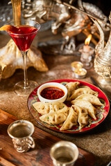 Chinese traditional dumplings vertical photography ornate atmosphere drinks hot sauce