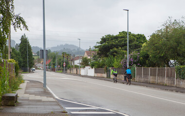 MTB cyclists on route crossing a rural town
