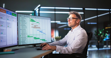 Employee Working On Calendar Schedule