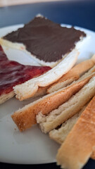 Bread with chocolate and strawberry spread with cut crust