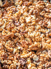 a pile of walnuts kernels on the table.