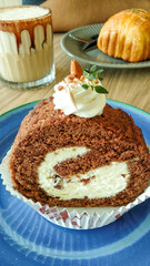 Tiramisu Roll Cake served on a blue plate