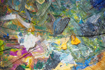 Wooden surface with colorful abstract designs.