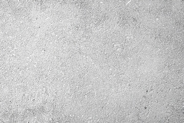 Obraz premium Close-up of a rough gray concrete surface with a fine, textured pattern. Perfect for backgrounds or design use.