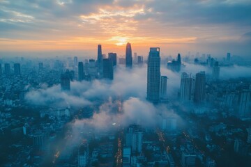 Fototapeta premium City skyline at sunrise with mist drifting among the skyscrapers in a vibrant urban landscape