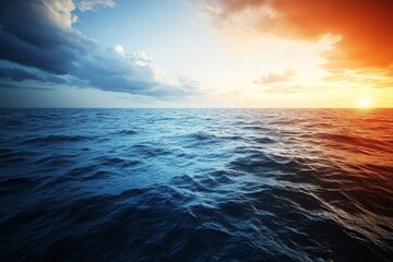 Obraz premium Sunset over the tranquil ocean with gentle waves and colorful sky in a serene coastal landscape