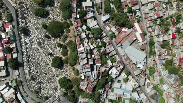 Dense rooftops and a cemetery in guarenas, miranda, venezuela , aerial view