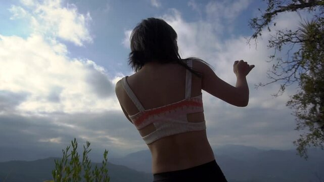 Asian Girl in Bikini is Dancing on the Edge of Clif in Jungle in Mexico, Oaxaca State. Traveller Indonesian Girl.