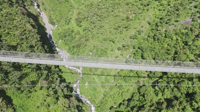 Hanging Bridge of Nepal with mountain and River