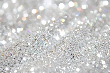Glittering sparkles on a white background for elegant design projects and festive events