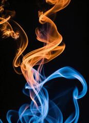 Obraz premium Blue fire and smoke over black background 