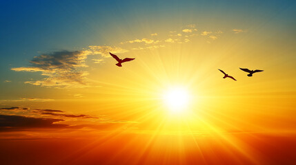 Naklejka premium Bright and vibrant sunset with radiant sun rays over the ocean and birds flying in the distance, symbolizing peace, freedom, and natural beauty.